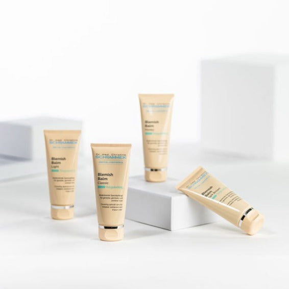 Verschillende varianten van Dr. Schrammek Blemish Balm in een overzicht – toont het volledige assortiment.