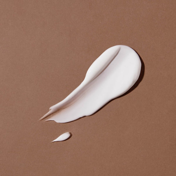 Close-up van de romige textuur van Absolution Le Lait Peau Douce bodymilk