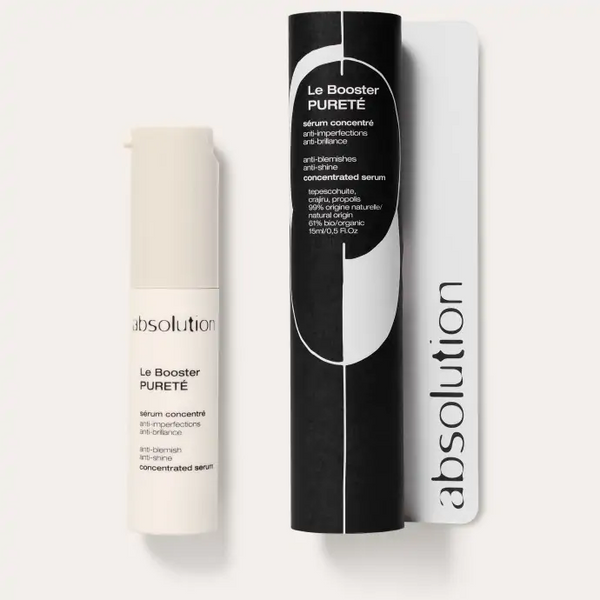 Absolution Le Booster Pureté serum met verpakking op een witte achtergrond.