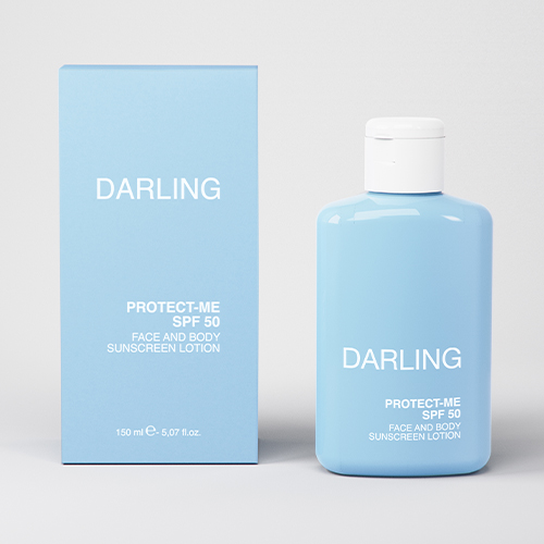 Darling Protect-Me SPF 50 zonnebrandcrème naast de luxe blauwe verpakking
