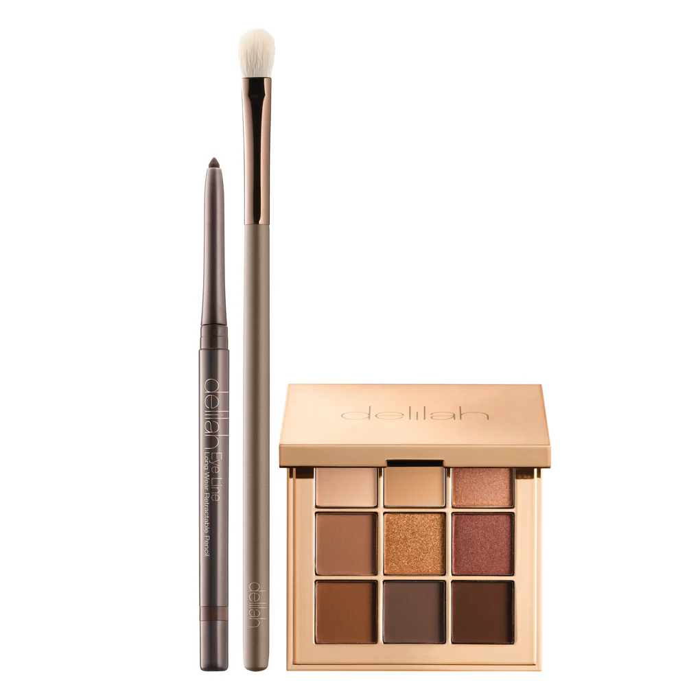 Close-up van het Venus kleurenpalet met warm getinte oogschaduws in bronzen, gouden en neutrale matte tinten, naast de Twig Eye Line Pencil.